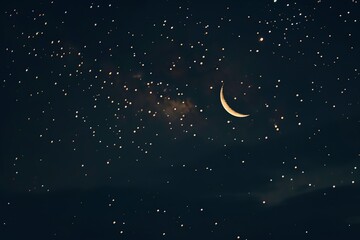 Obraz na płótnie Canvas A starry night sky with a crescent moon