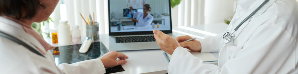 Web banner with group of doctors having online conference discussing new treatment