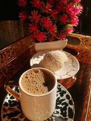 arabic cup coffee , biscuits and red roses