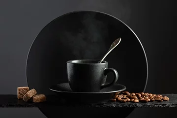 Küchenrückwand glas motiv Cup of black coffee with coffee beans and brown sugar. © Igor Normann