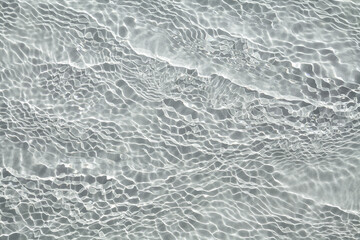Transparent water with flecks of sunshine