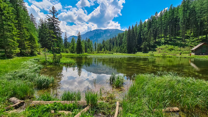 Panoramic view of alpine lake Josersee surrounded by forest in Hochschwab mountains, Styria,...