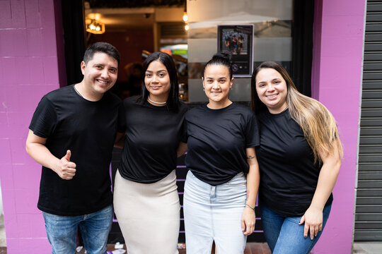 Bar workers posing together.