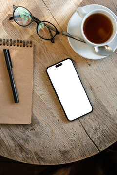 Mobile phone with white screen on the table