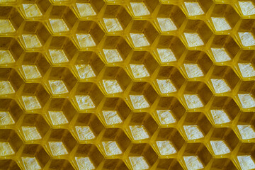 Background texture and pattern of section voshchina of wax honeycomb from a bee hive for filled with honey. Voshchina an artificial basis for the construction of honeycombs, sheet of wax of cells