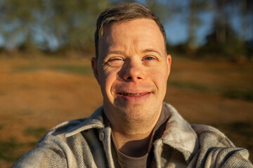 UGC selfie of man with down syndrome in nature