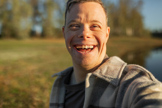 UGC selfie of man with down syndrome in nature