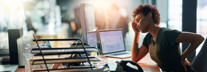 Business woman, stress and back pain on computer for human resources report, confused or fatigue in office. African worker with headache and overworked on desktop for payroll mistake on a banner - obrazy, fototapety, plakaty