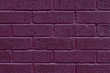 Close up of painted pink brick wall texture background.