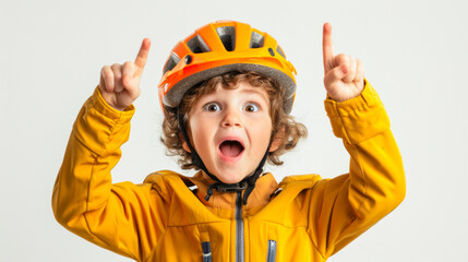 Excited Child Cyclist. Surprised boy in yellow shirt and helmet pointing upwards.