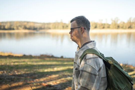 man with down syndrome walking in nature