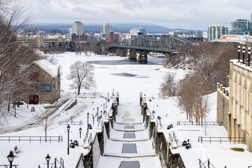 Rideau canal in Ottawa, Canada. View on Ottawa river, Alexandra bridge and Gatineau in winter