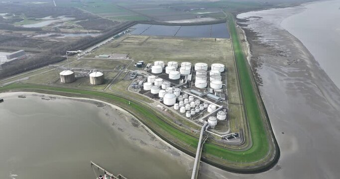 Tank terminal of Terneuzen, Bulk energy and chemical products are stored in these terminals. multimodal transport of sea and land. Fuels and energy products. Storage cotnainers and a ship docked for