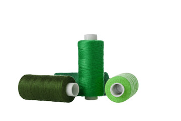 green spool of sewing thread isolated on white background close up