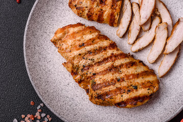 Delicious fresh grilled chicken fillet with spices and herbs - obrazy, fototapety, plakaty