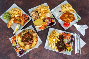Fototapeten A variety of Asiatic European and American dishes. Top view. Flat lay © sergojpg