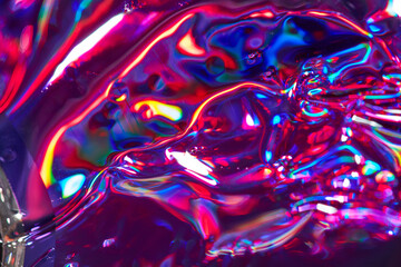 Refractions of colorful light on surface of broken CD disc