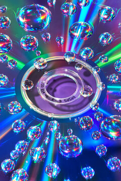 Gradient background formed by rainbow water drops CD disc