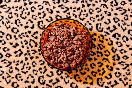 orange glass bowl with some plant-based ground meat