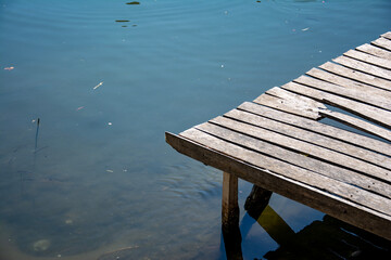 Wooden pier on the lake with river. Nature background. Wooden pier on the lake in the park with...