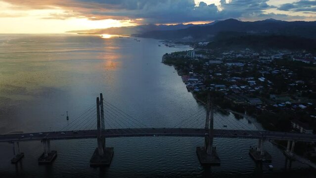 Aerial View of Iconic Merah Putih Cable Stayed Bridge accross Ambon Bay and Wai Ruhu Galala Yellow Truss Bridge. 