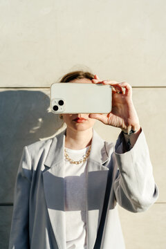 Female taking photo with smartphone