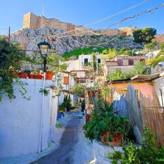 Photo of the lovely Anafiotika in Athens, Greece. Anafiotika is a scenic tiny neighborhood of the center of Athens, part of the old historical neighborhood called Plaka.