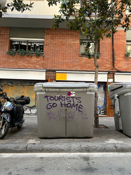 Graffiti inscription on a street dumpster