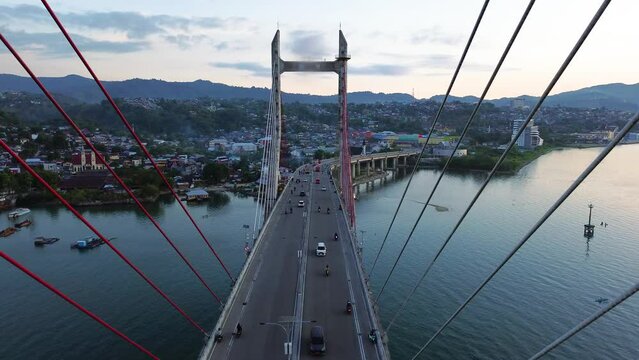 Aerial View of Iconic Merah Putih Cable Stayed Bridge accross Ambon Bay and Wai Ruhu Galala Yellow Truss Bridge. 