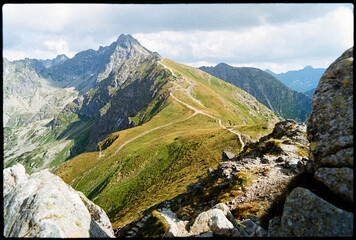 Beautiful mountain landscape with a trail on a sunny day