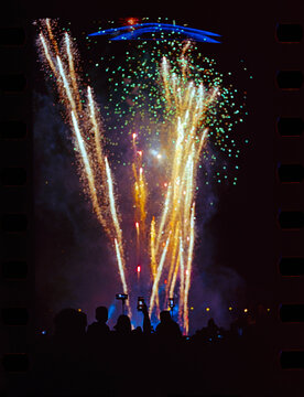 An amateur shot on film with the night fireworks and the audience.