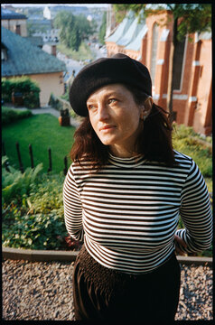 Portrait of an attractive French woman in an old European city