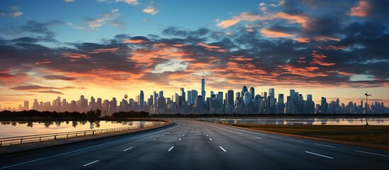 Asphalt road and modern city skyline