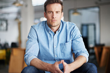 Portrait, serious and designer with office, workspace and happiness for creative agency. Man,...