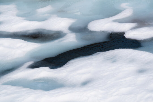 Abstract Blue Process Of Snow Melt