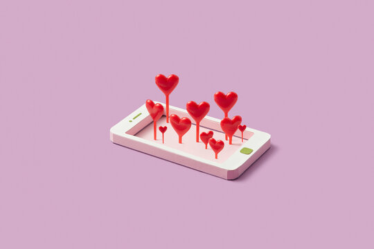 Red hearts sticking out paper made smartphone frame