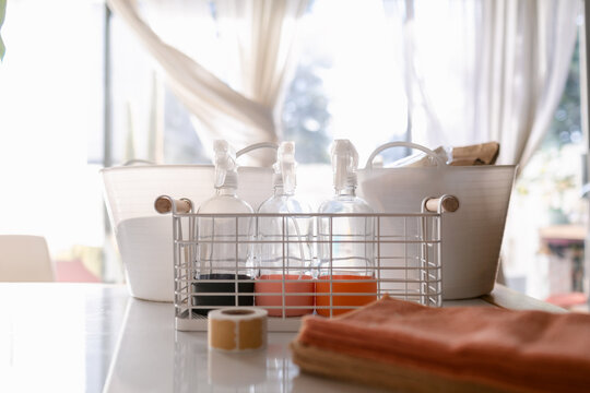 Glass spray bottles on basket