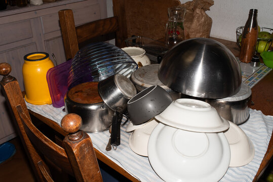 Still direct flash of pile of dishes drying