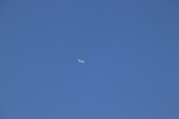 Airplane flying in blue sky