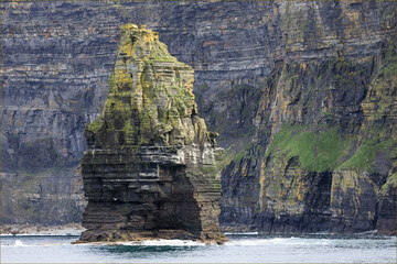 A sea stack of rock  at the cliffs of Moher - Powered by Adobe