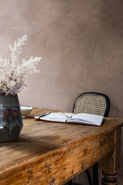Still life of an open notebook on a rustic table