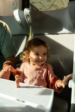 A toddler in a train