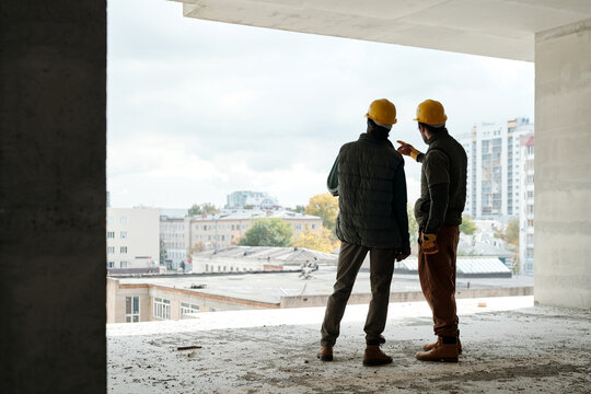 Construction Workers Discussing Plan