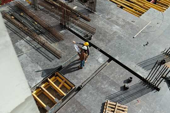 Two Men Discussing Site Plan