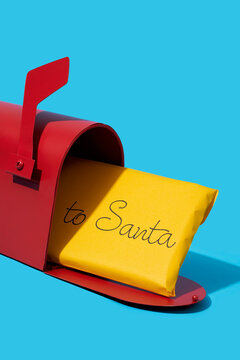 yellow letter to santa in a mailbox