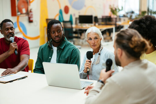 Diverse friends talking on a live podcast
