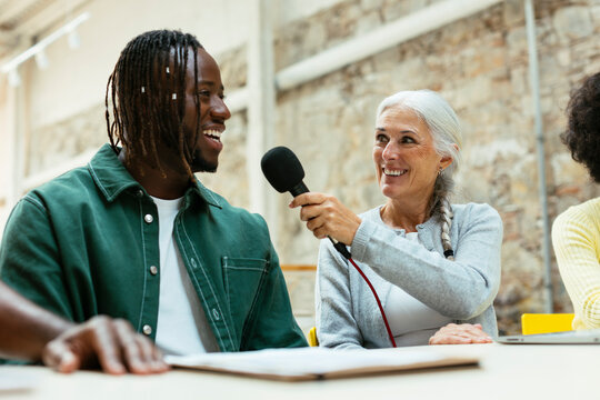 Diverse friends talking on a live podcast