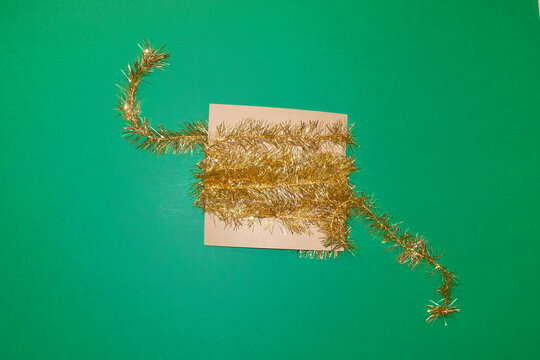 Golden shiny sparkly Christmas tinsel with hard flashlight