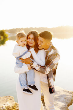 Beaming family standing sunshine nurturing ties