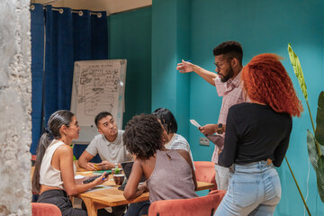 Multiracial Group Of Colleagues Working In The Co-Working Office.